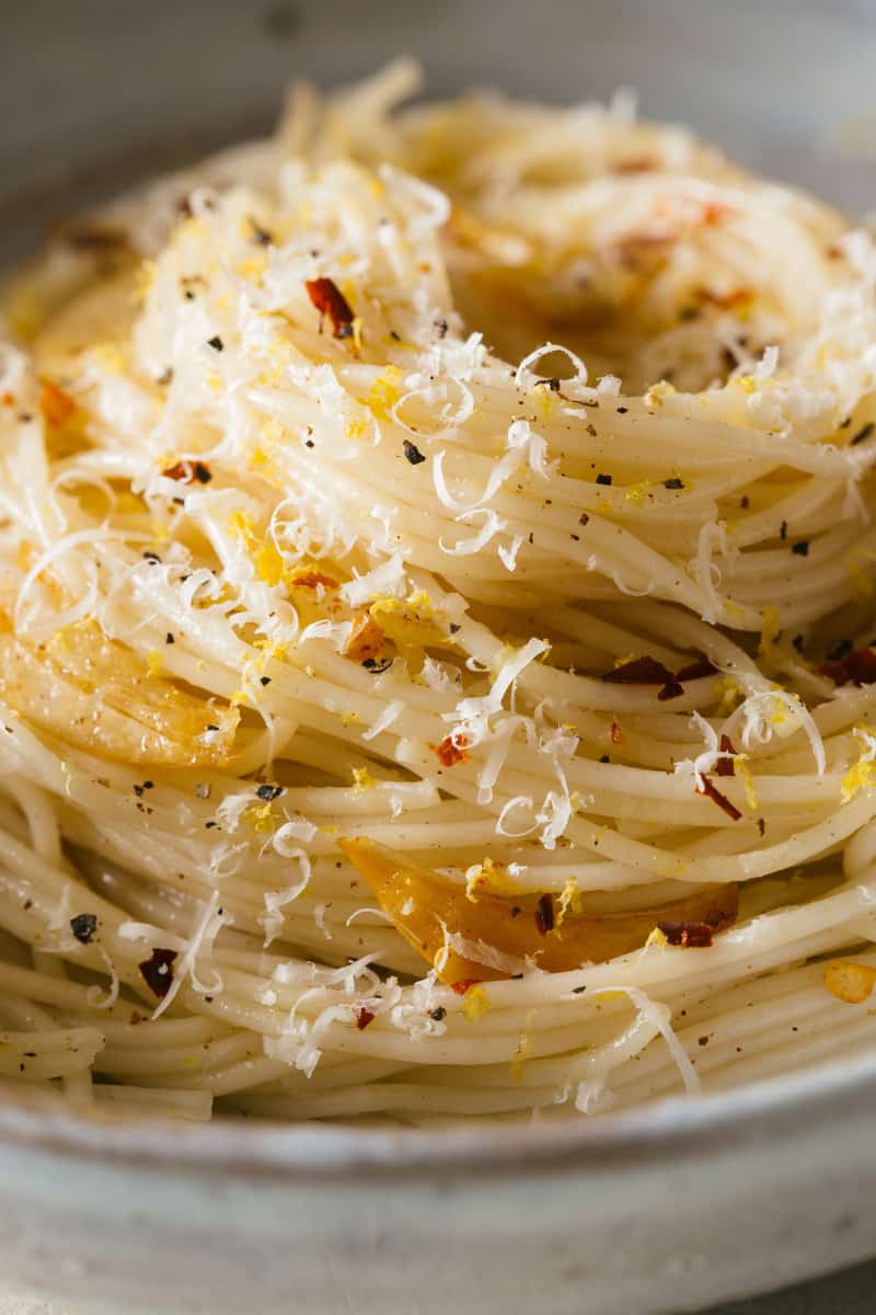 A close up shot of capellini in a spiral shape. 