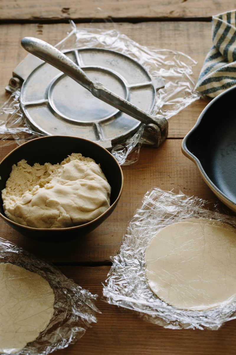 Homemade corn tortilla process, dough, press and finished tortilla.