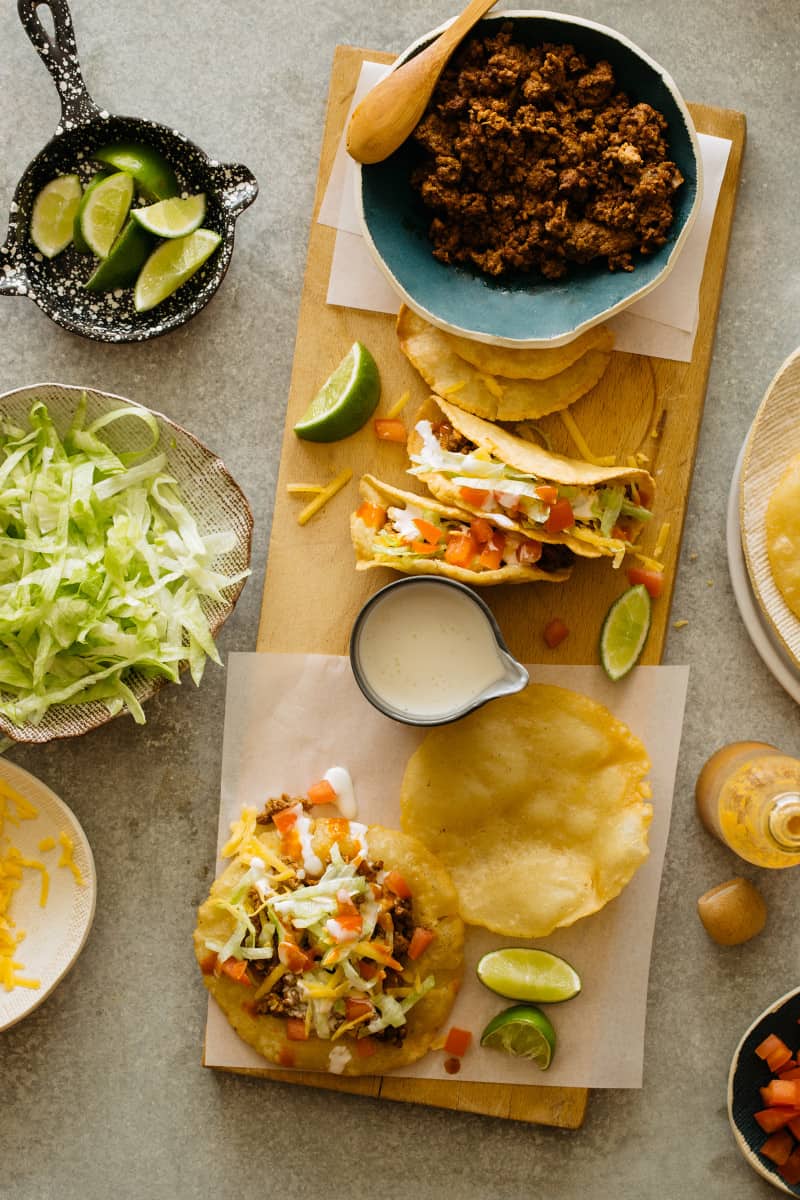 DIY hard and puffy corn tortillas, flat and folded, tacos and fixings.