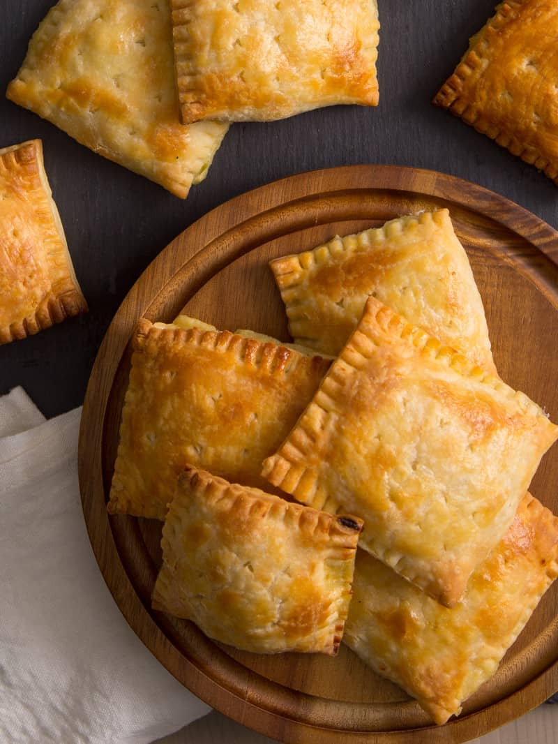 A close up of a plate of chicken pot pie hand pies.