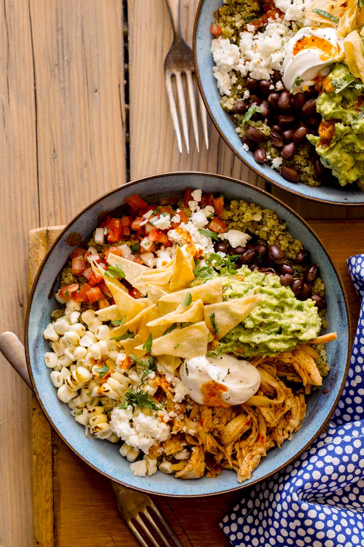 Honey chipotle chicken burrito bowls with forks.