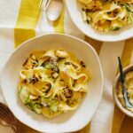 Bowls of sweet corn pesto with pappardelle and zucchini noodles.