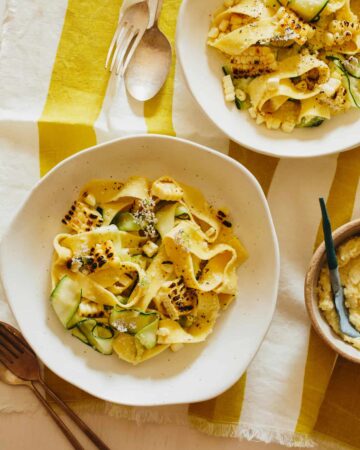 Bowls of sweet corn pesto with pappardelle and zucchini noodles.