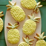 Pineapple shaped lime sugar cookies with pineapple buttercream.