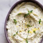 A bowl of black pepper and lemon asiago dip.