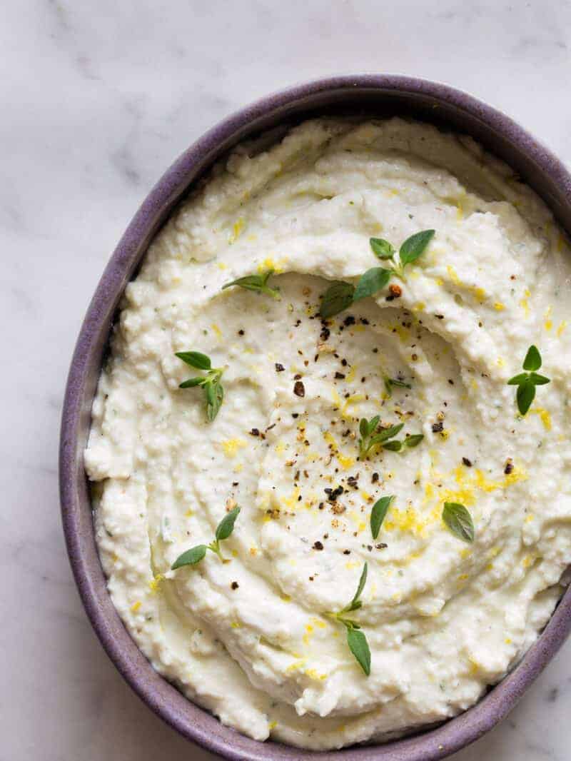 A bowl of black pepper and lemon asiago dip.