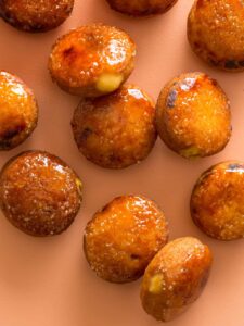 Artfully scattered pumpkin crème brûlée doughnuts.