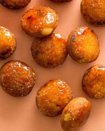 Artfully scattered pumpkin crème brûlée doughnuts.