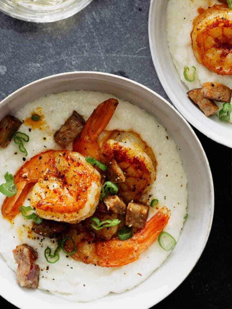 Shrimp and grits in two bowl shot overhead. 