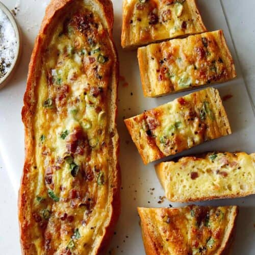 Baked egg boats with a knife.