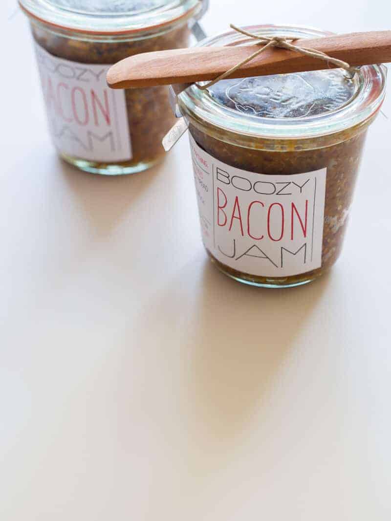 A close up of jars of boozy bacon jam for gifts.