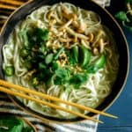 Green curry noodle soup in a bowl.