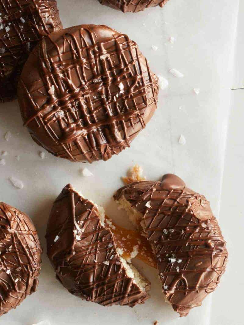 A close up of whole and broken salted Twix cookies.