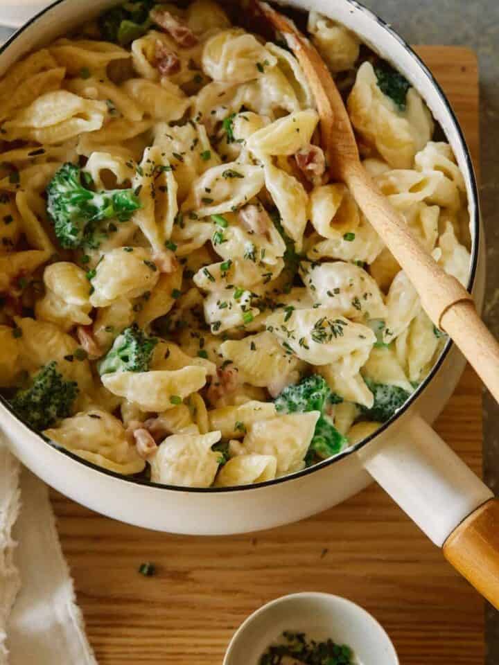 A close up of creamy white cheddar, pancetta, and broccoli stovetop mac and cheese.