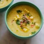 Sweet Corn Gazpacho recipe in a bowl on a counter.