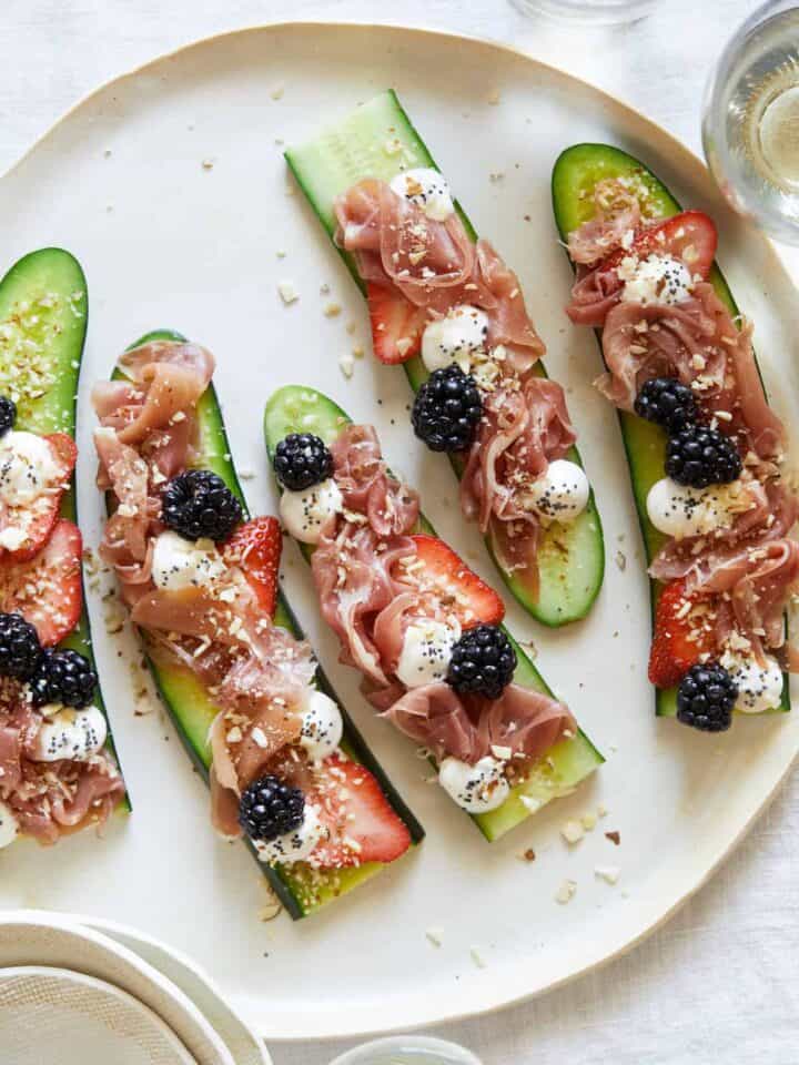 A plate of prosciutto cucumber crostini.