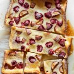 A sliced raspberry rhubarb clafoutis.