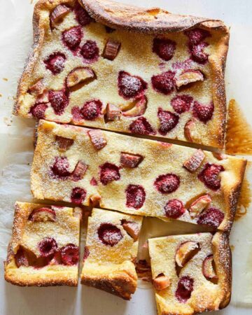 A sliced raspberry rhubarb clafoutis.
