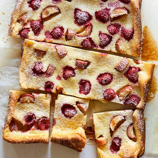 A close up on a raspberry and rhubarb clafoutis. 