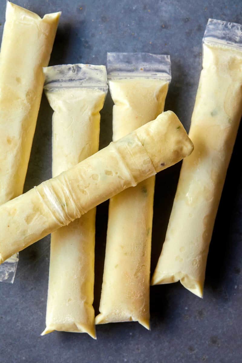 A close up on our pina colada Italian ice pops, one open.