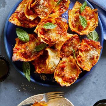 Lasagne cups on a blue plate.