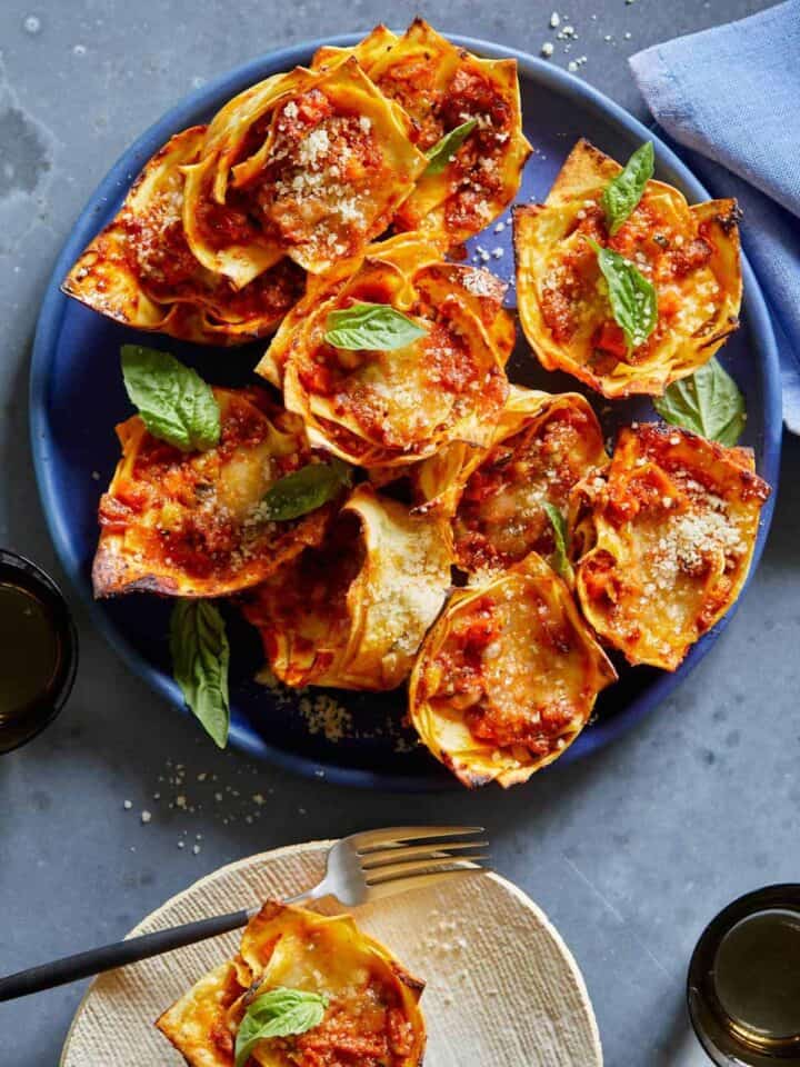 Lasagne cups on a blue plate.