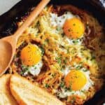 Cheesy Skillet Hash Brown and Eggs recipe with white toast ready to be eaten.