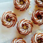 Mini citrus bundt cakes with sweet lemon glaze and lemon zest.