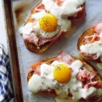 Close up of Croque Madame Toast on a baking sheet.