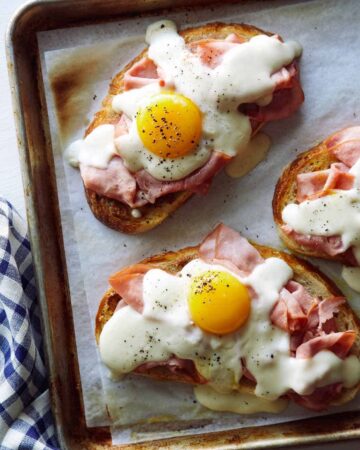 Close up of Croque Madame Toast on a baking sheet.