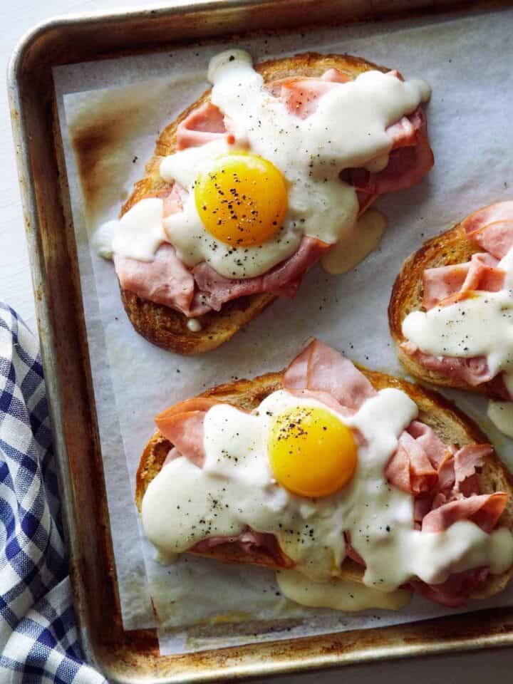 Close up of Croque Madame Toast on a baking sheet.