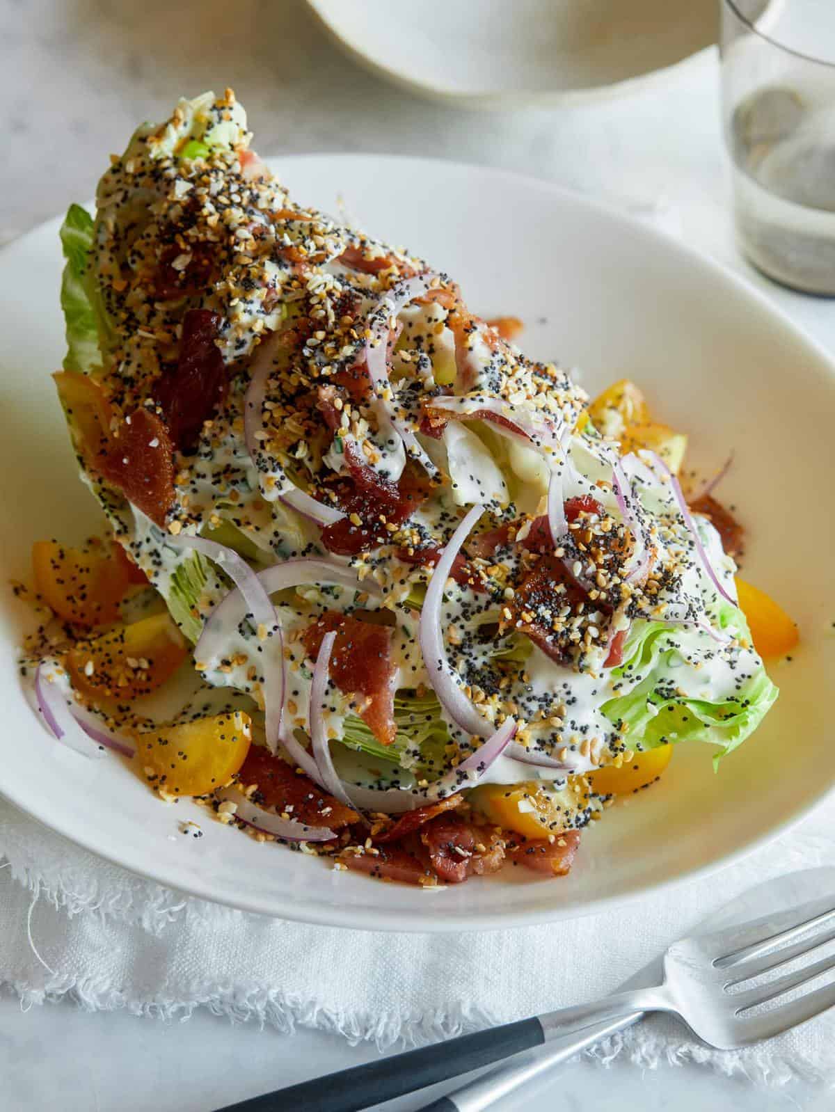 An everything bagel seasoning wedge salad in a bowl.