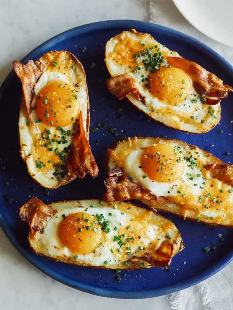 Twice baked breakfast potatoes on a blue plate.