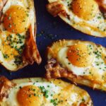 A close up of twice baked breakfast potatoes.
