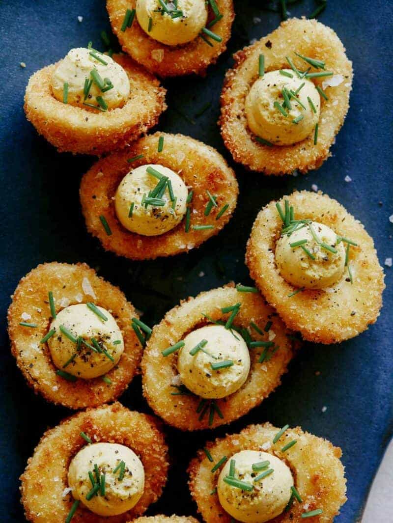 Fried Deviled Eggs close up on a platter ready to be served. 