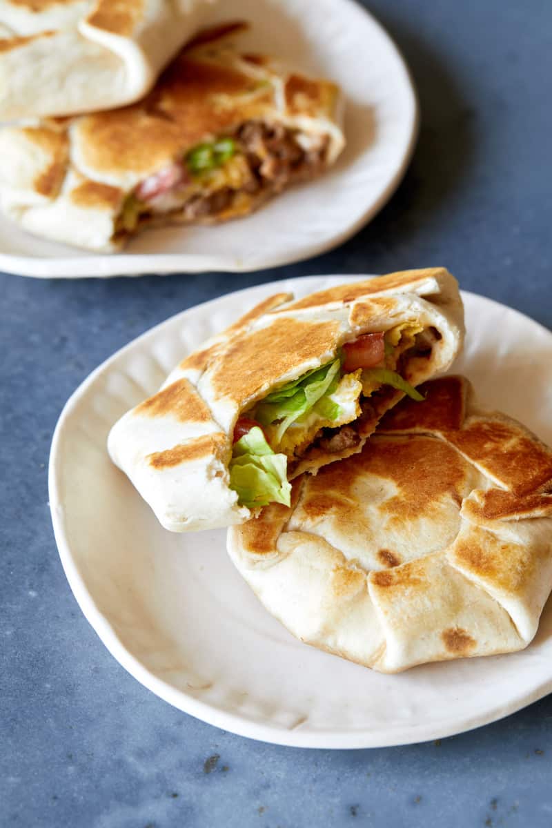 Small plates of mini crunchwrap supremes.