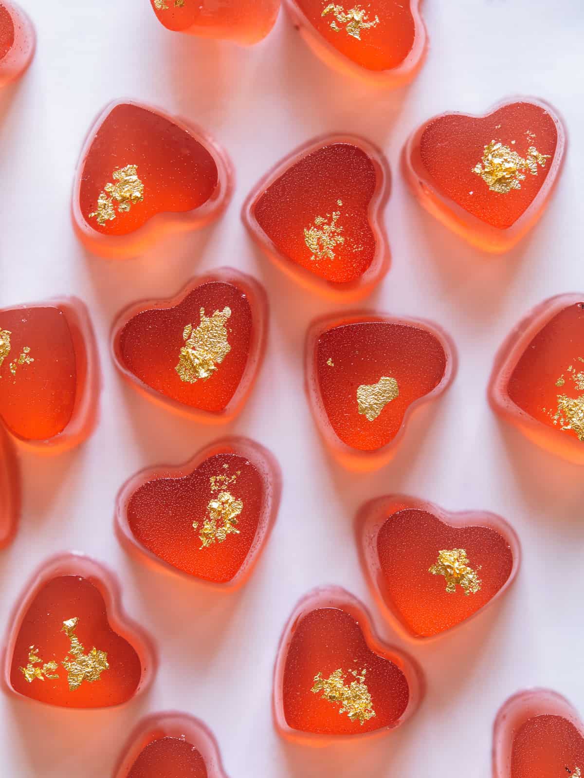 Strawberry gummies close up on a surface. 