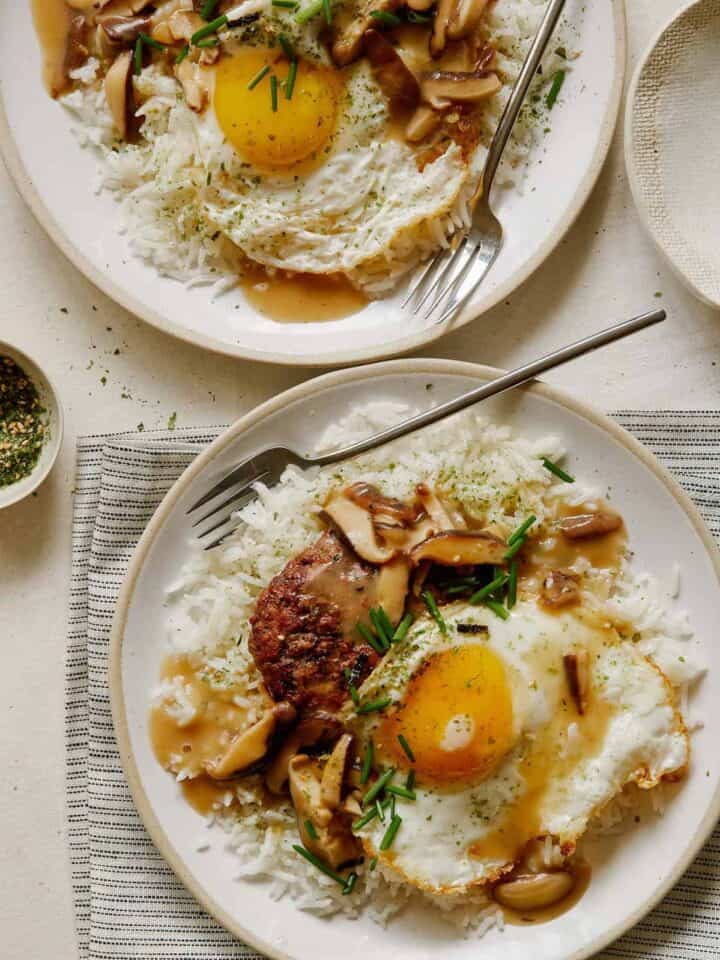 Loco Moco on a plates with a forks.