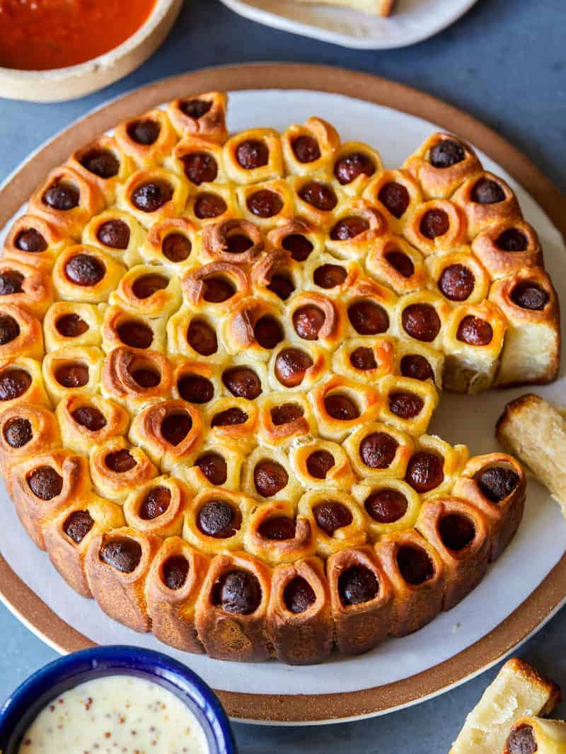 Pull Apart Pigs in a Blanket overhead with mustard and ketchup on the side.