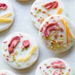 A close up of white chocolate dipped butter cookies.