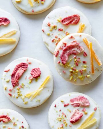 A close up of white chocolate dipped butter cookies.