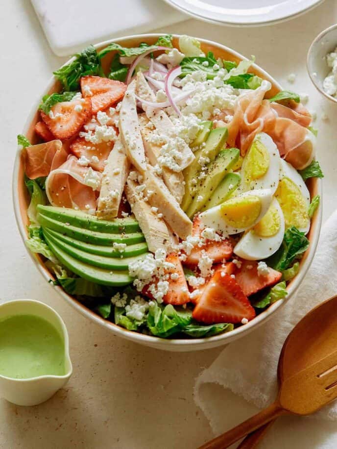 Strawberry cobb salad with dressing on the side.