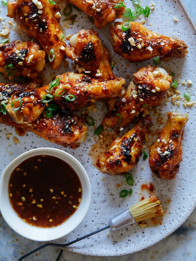 Chicken Drumette recipe with sauce on the side and a pastry brush.