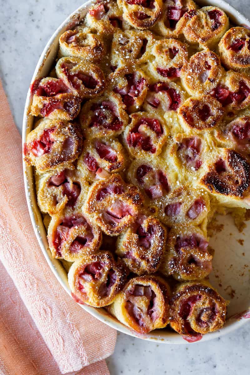 Strawberry and cinnamon French toast rollups with a portion taken out.