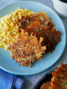 A plate of crispy cheese hash browns.