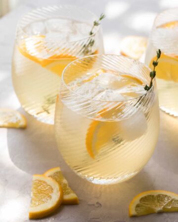 A close up of meyer lemon and thyme bees knees cocktails.