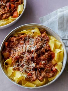 Bowls of braised pork ragu pappardelle.