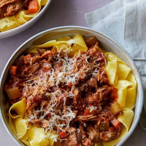 Bowls of braised pork ragu pappardelle.