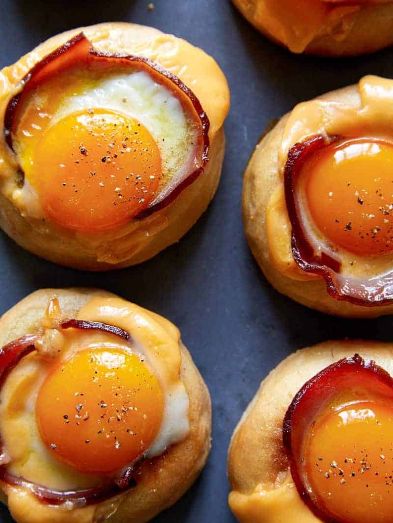 4 finished toad in a hole style breakfast sandwiches