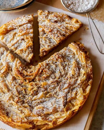 A sliced chai spiced ruffled milk pie.